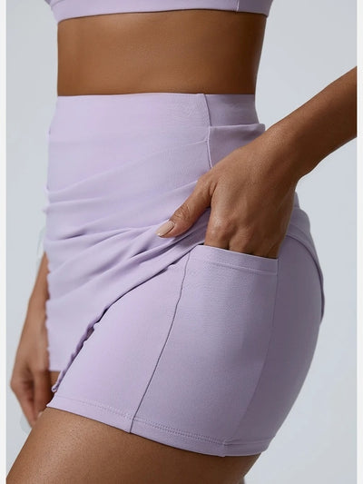 Jupe Short Fitness Femme, violet, vue de profil avec la poche latérale